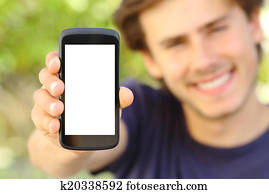 Happy man showing a blank mobile phone screen outdoor