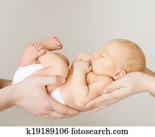 baby newborn sleeping on parents hands, kid and family concept baby newborn sleeping on parents hands, kid and family concept