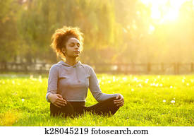 African american woman meditating in nature African american woman meditating in nature