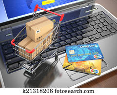 E-commerce. Shopping cart and credit cards on laptop. E-commerce. Shopping cart and credit cards on laptop.