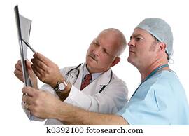 Doctor & Intern Examining Xray Doctor & Intern Examining Xray