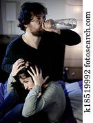 Crazy drunk husband abusing of young wife