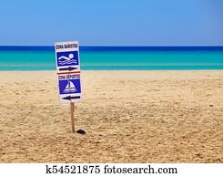 sign of bathing area on the beach for the safety of bathers compared to boats . 