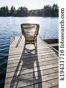 Rocking chair on small lake dock