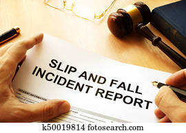 Slip and fall injury report on a table. Slip and fall injury report on a table.