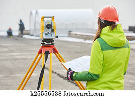 surveyor works with theodolite