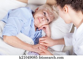 Elderly woman in bed