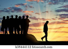 Silhouettes of people crowd expel the man from their community. Silhouettes of people crowd expel the man from their community.