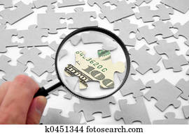 us dollar puzzle and magnifier