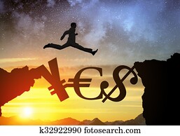 Silhouette of businessman over sunrise