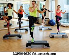 Multiracial group during aerobics class Multiracial group during aerobics class