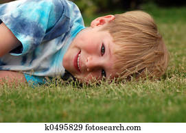 Boy Lying in Grass