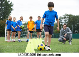 Coach Leading Outdoor Soccer Training Session Coach Leading Outdoor Soccer Training Session