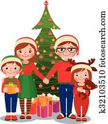 Family at Christmas tree with gifts