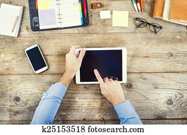 Desktop mix on a wooden office table.