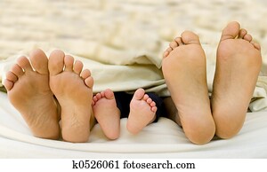 Parents feet with their new born Child