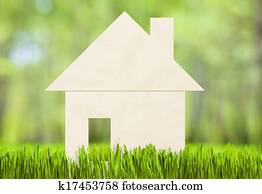 Paper house on green grass concept Paper house on green grass concept