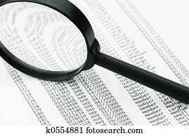 magnifying glass and business data