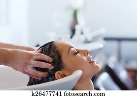 happy young woman at hair salon happy young woman at hair salon