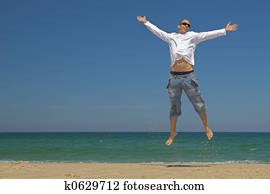 Man jumping on the beach