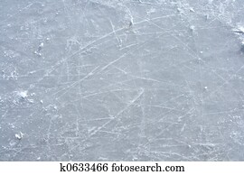Skate marks on the surface of an outdoor ice rink