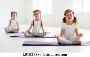 children girls doing yoga and gymnastics in gym children girls doing yoga and gymnastics in gym