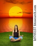 Making yoga at the sunset