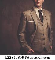 Well-dressed man in grey suit