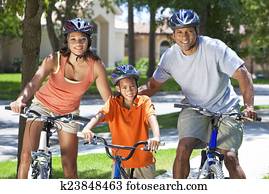 African American Parents WIth Boy Son Riding Bike African American Parents WIth Boy Son Riding Bike