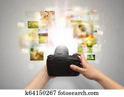 Hand captures life events with digital camera
