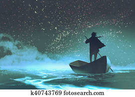 man rowing a boat in the sea man rowing a boat in the sea