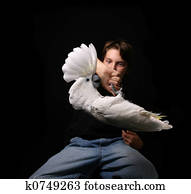 Child Holding Playful Umbrella Cockatoo Upside Down