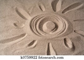 draw of a sun on sand draw of a sun on sand