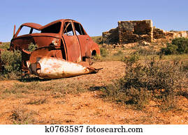 old car and ruins
