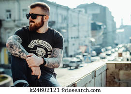 young guy with a beard and glasses young guy with a beard and glasses