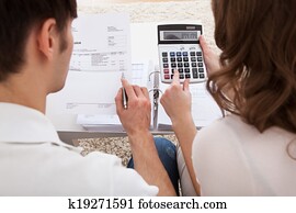 Young couple calculating budget