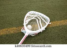 Goalies lacross stick with a ball in the net Goalies lacross stick with a ball in the net