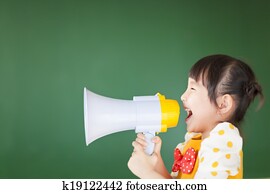 happy kid shouts something into the megaphone happy kid shouts something into the megaphone