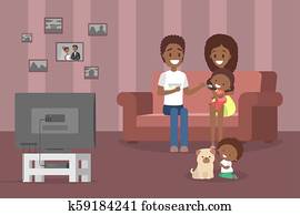 Family watching tv in the living room