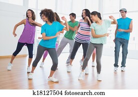 Fitness class and instructor doing pilates exercise Fitness class and instructor doing pilates exercise
