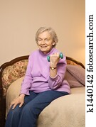 Mature woman lifting weight.