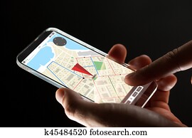 close up of hand with gps map on smartphone close up of hand with gps map on smartphone