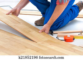 Man laying laminate flooring Man laying laminate flooring