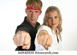 Martial arts man and woman punching Martial arts man and woman punching