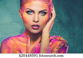 Beautiful young woman with conceptual colourful body art Beautiful young woman with conceptual colourful body art