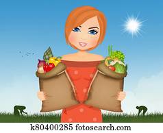 woman collects vegetables in the vegetable garden woman collects vegetables in the vegetable garden