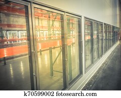 Row of empty commercial fridges at wholesale big-box store Row of empty commercial fridges at wholesale big-box store