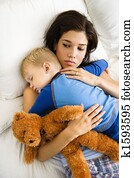 Mom with sleeping child.