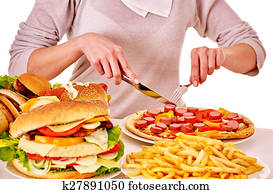 Woman eating junk food.