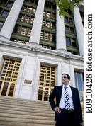 Young Attorney in Front of Courthouse Young Attorney in Front of Courthouse